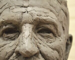 traditional clay portrait sculpture in progress detail 1